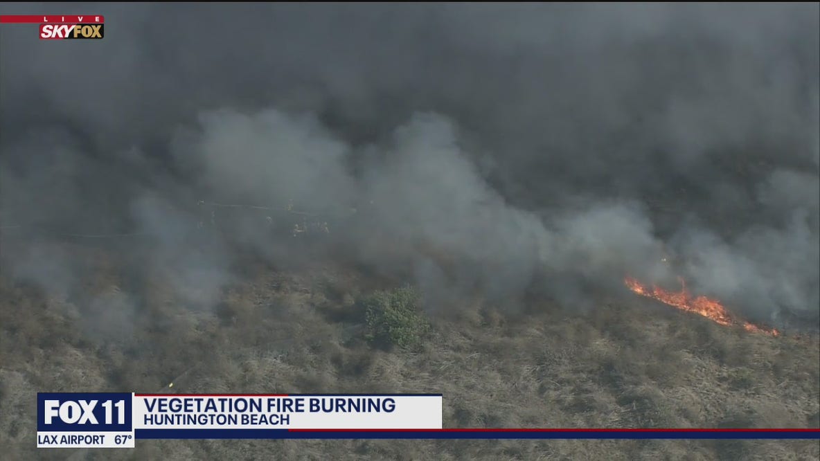 Crews battling fire in Huntington Beach